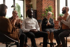 Addiction group discussing the 12 steps
