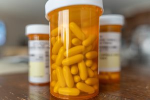 Doctor explaining prescription painkillers and pain management treatment